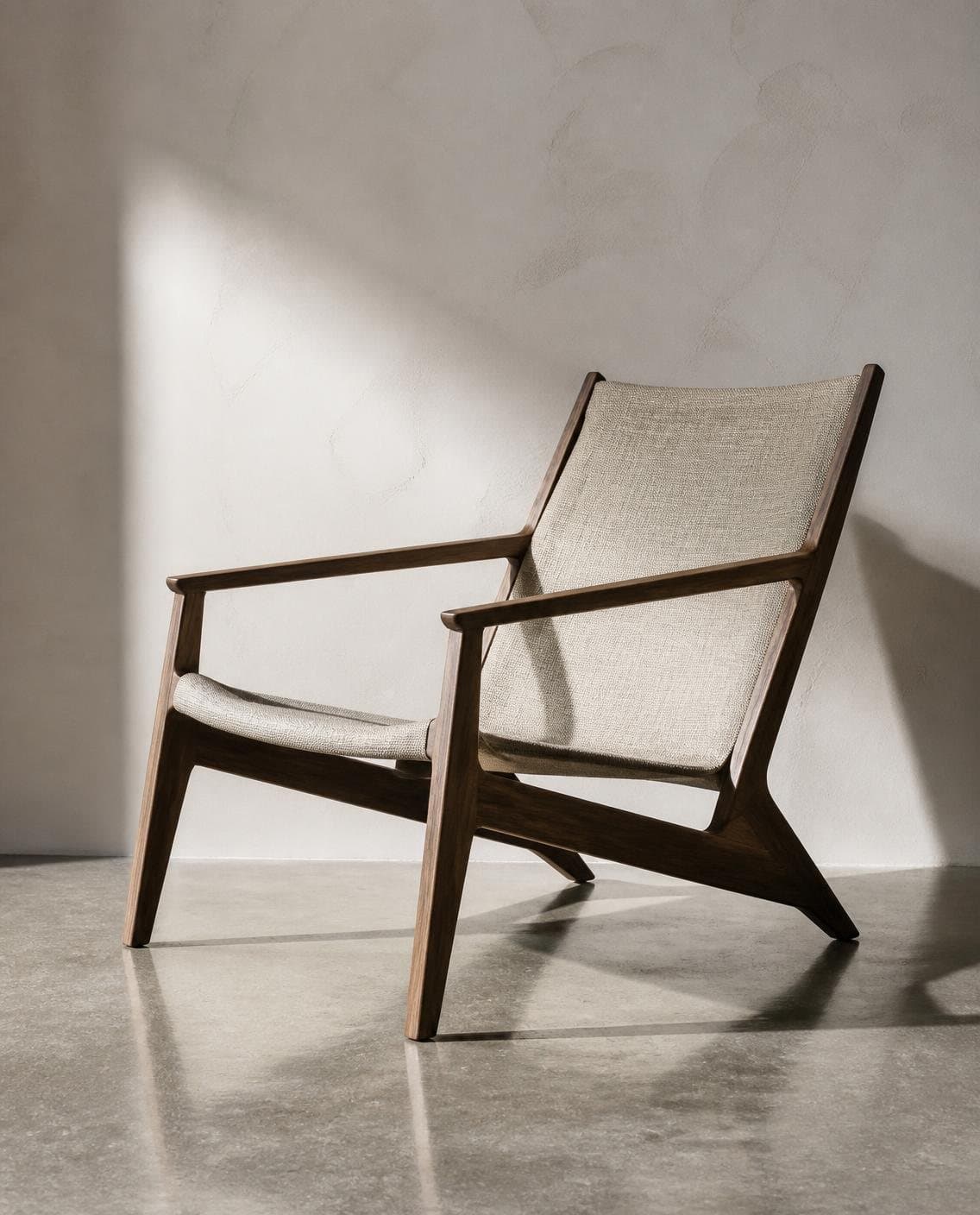 Illustrative custom lounge chair with a walnut frame and woven linen seat